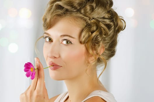 beauty woman closeup portrait with flower over grey background