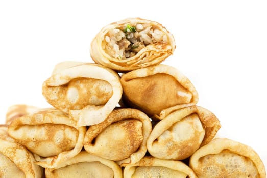 a pancakes with meat and rice closeup