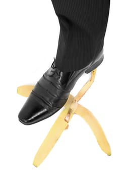 Business risk concept: boot to step on a banana