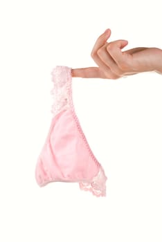 Woman hands hold pink pants isolated on white background