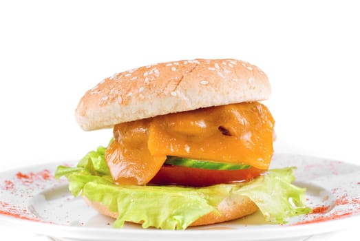 Cheeseburger at plate isolated on a white background