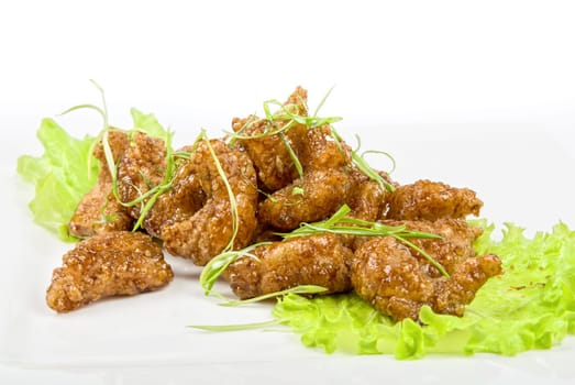 Gourmet fish fillet at caramel isolated on a white