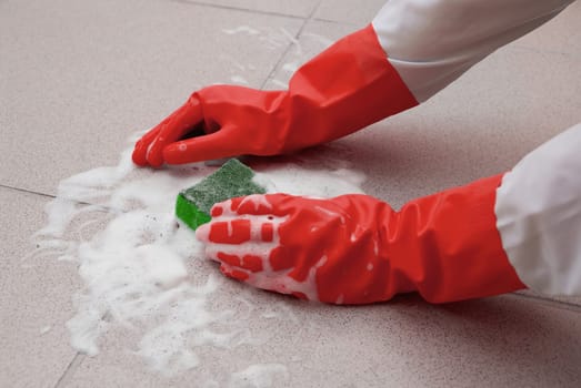 protecting hand from detergents, washing floor by cleaning sponge