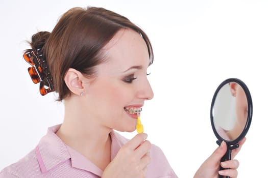 Dental hygenist demonstrating tooth cleaning