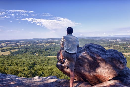 Retired hiker on top of Bull Mountain in Virginia overlooking the valley towards the Blue Ridge and Shenandoah