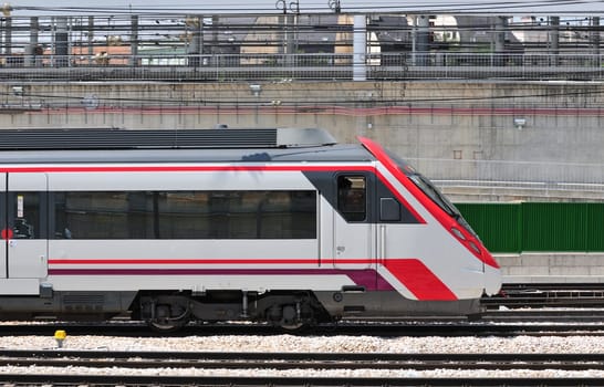 Passenger train just arriving at Atocha railway station in Madrid (Spain)