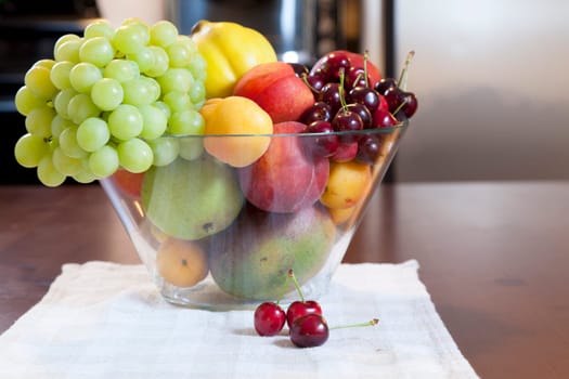 Glass bowl of fruit on the kitchen table
