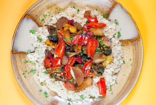 A healthy vegan dinner of brown rice and roasted vegetables