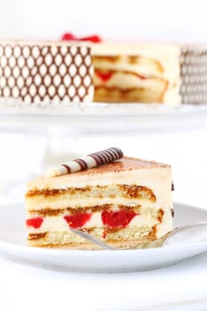 Delicious Tiramisu birthday cake with cherries