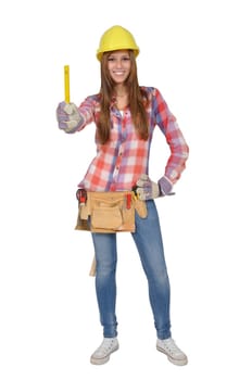 Attractive young artisan with a tool holding a yellow ruler