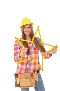 Attractive young woman holding a yellow star of a ruler