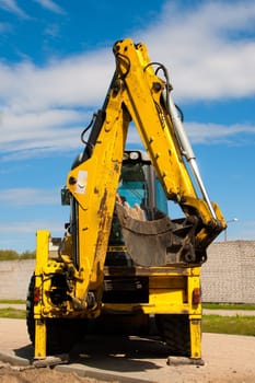 Excavator parked by the construction site