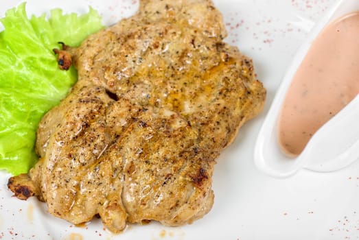 fried chicken meat with sauce and lettuce