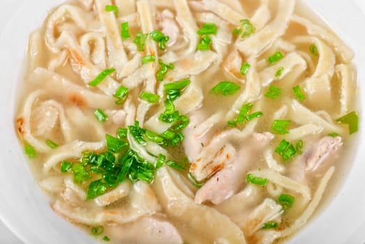 Chicken noodle soup isolated on a white