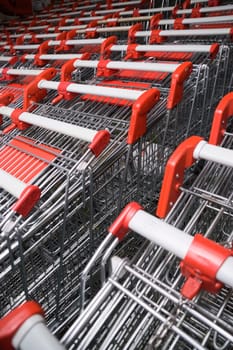 Shopping trolleys pushed inside each other in several rows