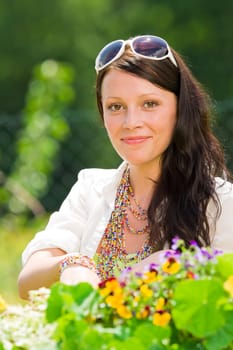 Summer garden beautiful young woman smiling flowers