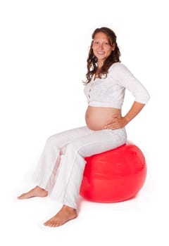 Pregnant young woman with ball