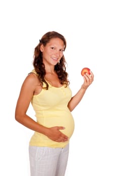 Pregnant young woman with apple
