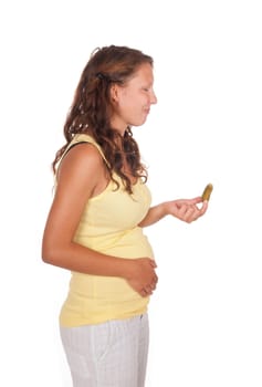 pregnant young woman with cucumber