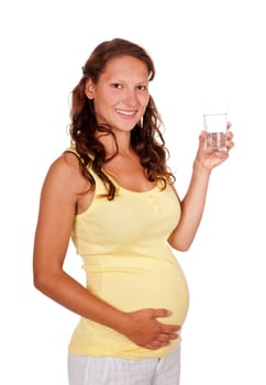 Pregnant young woman with glass of water