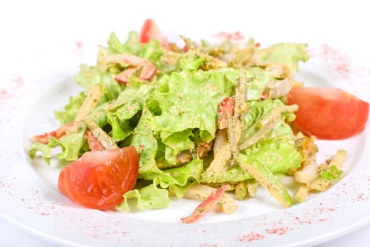 Salad of squid with roast chicken meat, apples, tomatoes, eggs and peppers