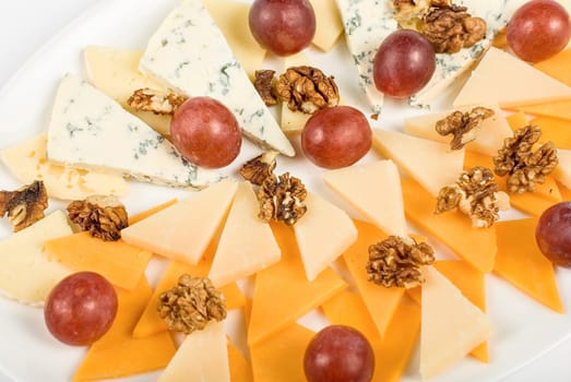 different cheese and grapes close up composition