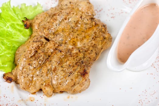 roasted chicken meat with sauce and lettuce