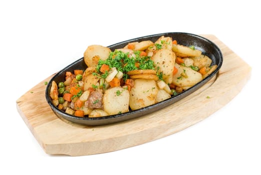 Fried potato with meat and vegetables on a white