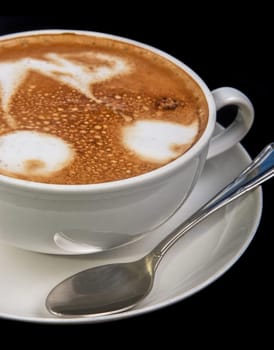 Cup of latte on a dark background