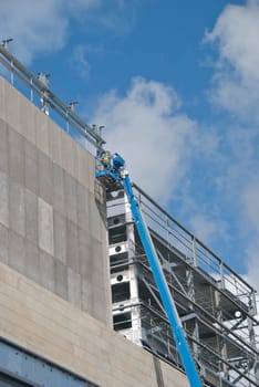 A Blue Cherry Picker Platform on a construction site