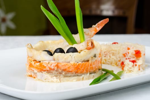 tasty prepared fish with rice and vegetables