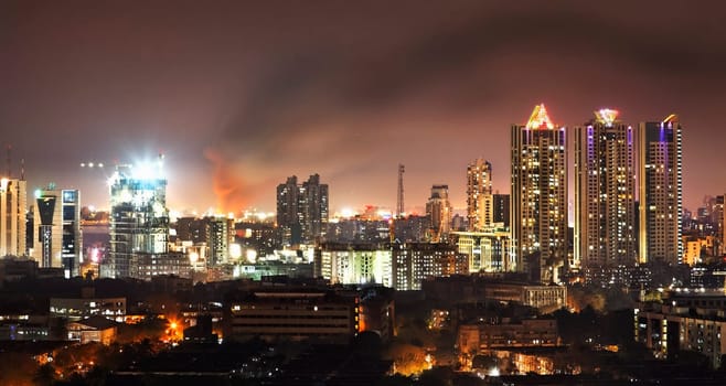 Mumbai, India - April 2011, night time panoramic view of the fire at Bandra railway station from an 18 story building, landscape, copy space, crop space