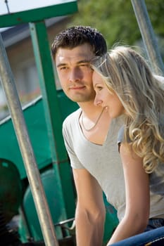 Woman cuddling with her boyfriend in countryside