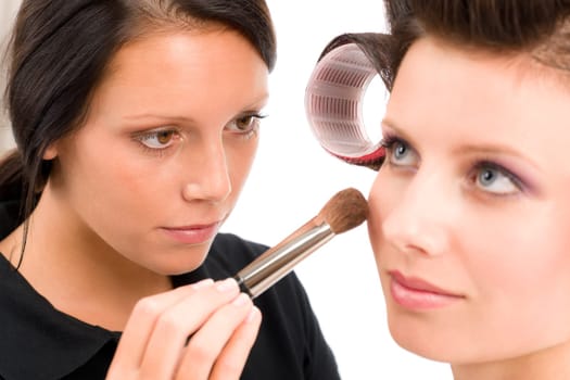 Make-up artist woman fashion model apply powder blush rouge brush
