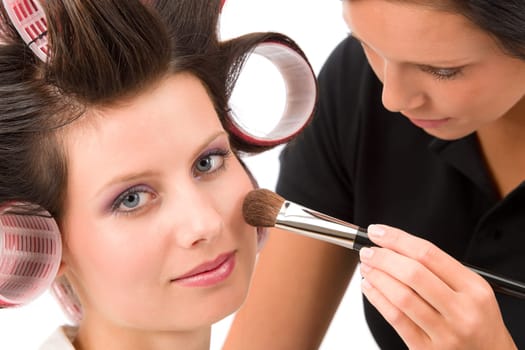 Make-up artist woman fashion model apply powder blush rouge brush