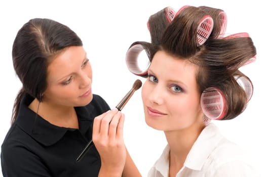 Make-up artist woman fashion model apply eyeshadow with brush