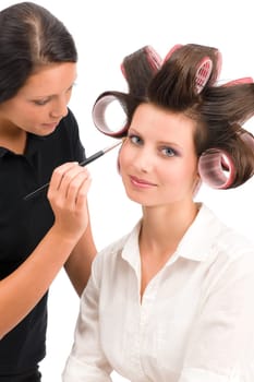 Make-up artist woman fashion model apply eyeshadow with brush