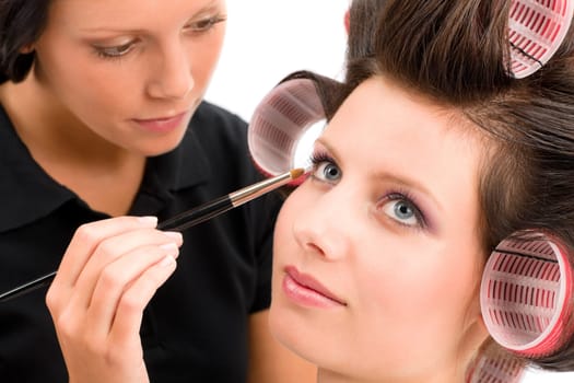Make-up artist woman fashion model apply eyeshadow with brush