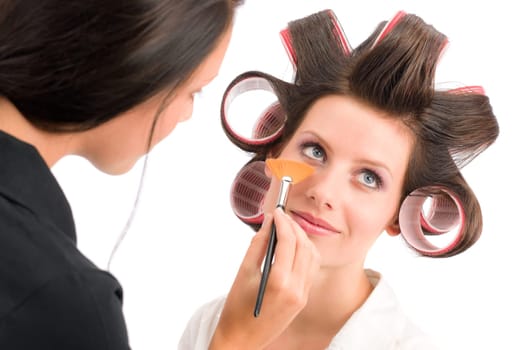 Make-up artist woman fashion model apply powder blush rouge brush