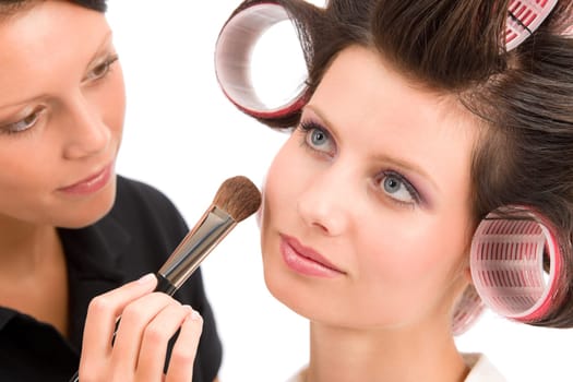 Make-up artist woman fashion model apply powder blush rouge brush