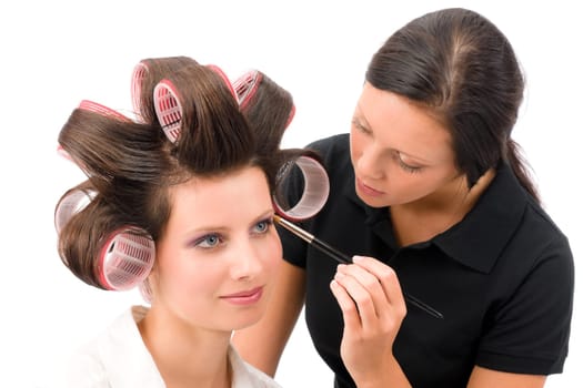 Make-up artist woman fashion model apply eyeshadow with brush