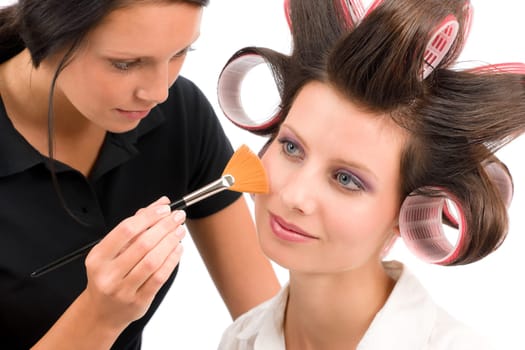 Make-up artist woman fashion model apply powder blush rouge brush