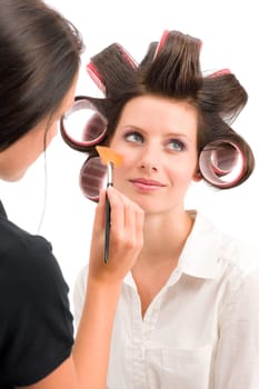 Make-up artist woman fashion model apply powder blush rouge brush