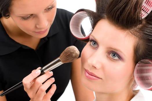 Make-up artist woman fashion model apply powder blush rouge brush