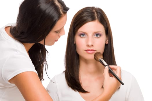 Make-up artist woman fashion model apply powder blush rouge brush
