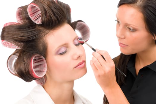 Make-up artist woman fashion model apply eyeshadow with brush