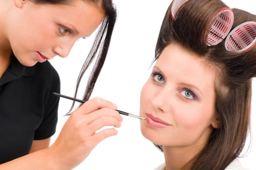 Make-up artist beautiful woman fashion model apply lipstick