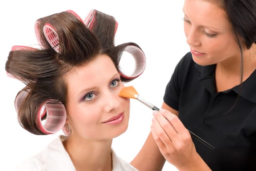 Make-up artist woman fashion model apply powder blush rouge brush