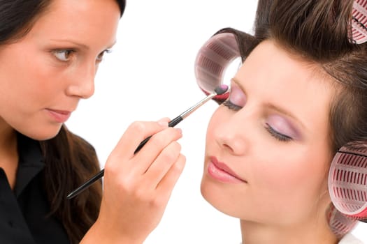 Make-up artist woman fashion model apply eyeshadow with brush