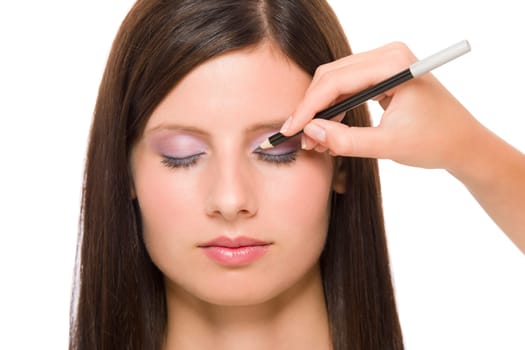 Professional makeup model portrait artist make eye lines using pencil